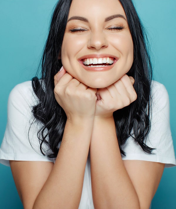 A dental patient after composite bonding